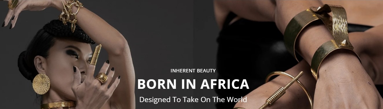 Model wearing bold handcrafted African gold jewelry by Adele Dejak, showcasing sculptural bracelets, rings, and earrings celebrating African luxury design.